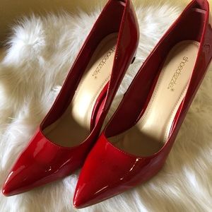 Beautiful red pump with gold heels.
